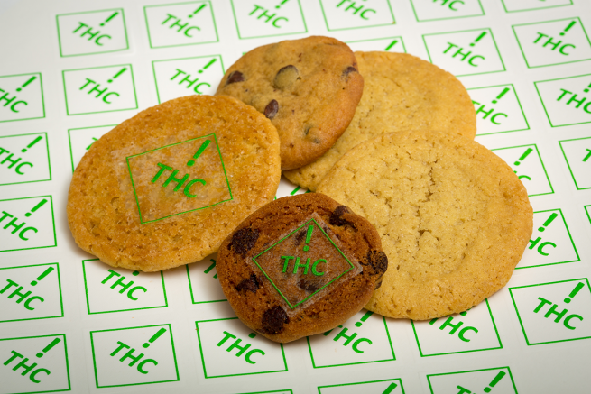 cookies with THC symbols on them in green