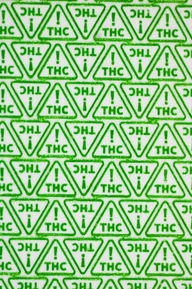 green triangles with ! thc symbols inside and a white background