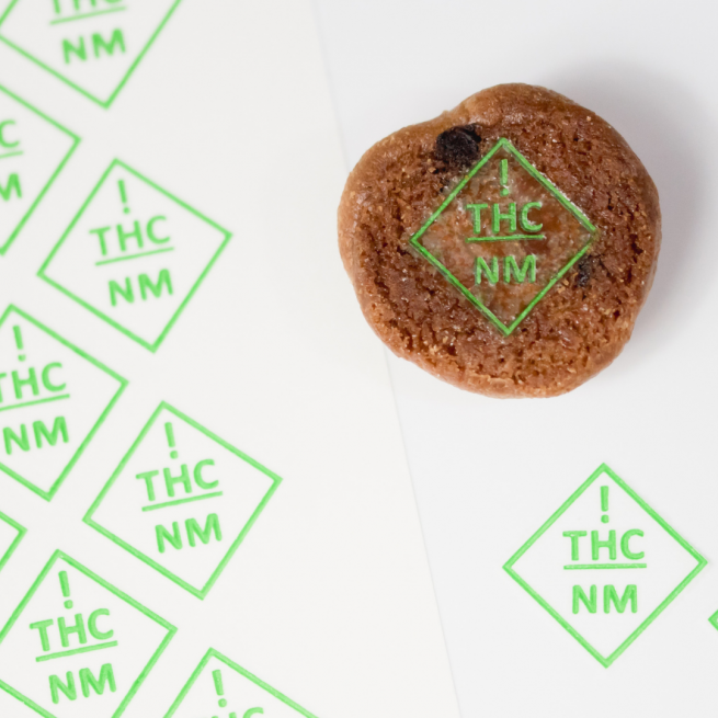 a cookie embossed with new mexico thc symbol