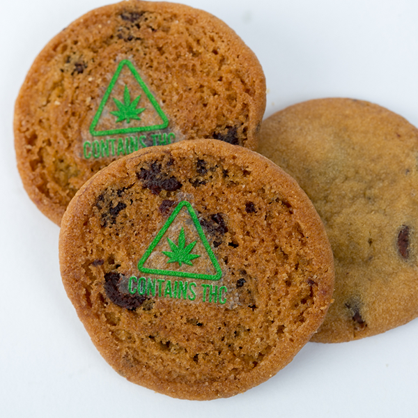 cookies marked with green cannabis leaf triangle symbols that say "CONTAINS THC"