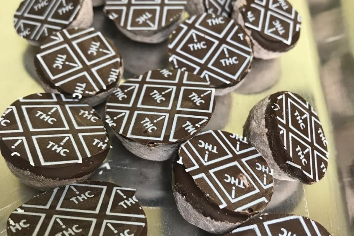 chocolate truffles with white thc symbols imprinted