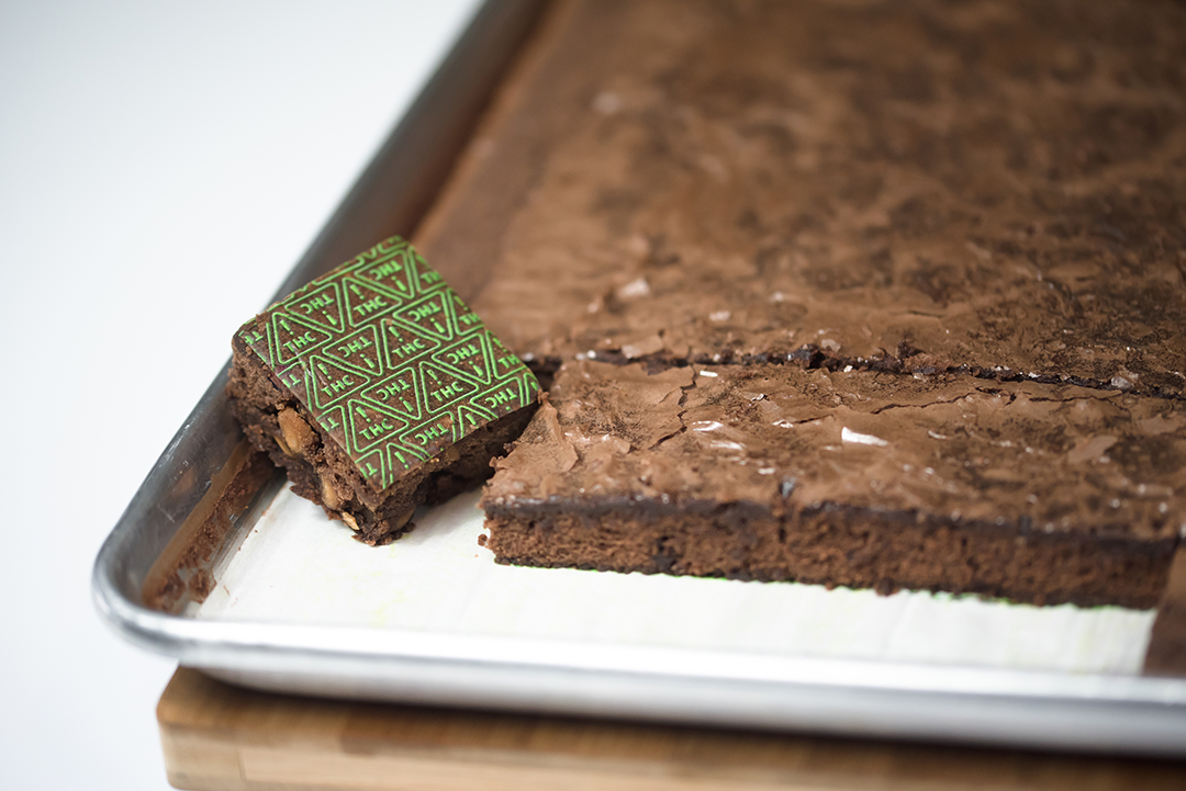 Nevada THC symbol sheets on brownie in tray