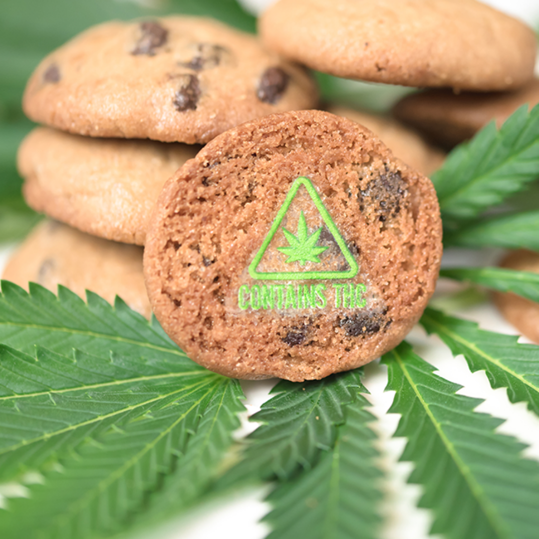 a cookie with a green contains thc symbol