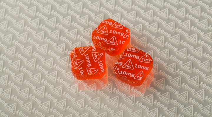 red marijuana edible candy marked with 10mg THC symbols